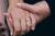 A woman wearing one carat diamond ring
