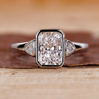 Radiant cut engagement ring with white gold ring.