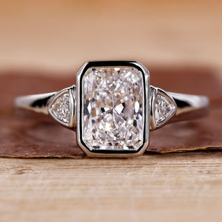 Radiant cut engagement ring with white gold ring.