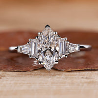 Marquise engagement ring with 5 stone diamond ring.