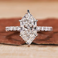 Hidden halo engagement ring with Dutch marquise diamond engagement ring style.