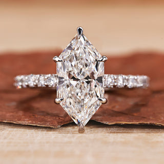 Hidden halo engagement ring with Dutch marquise diamond engagement ring style.