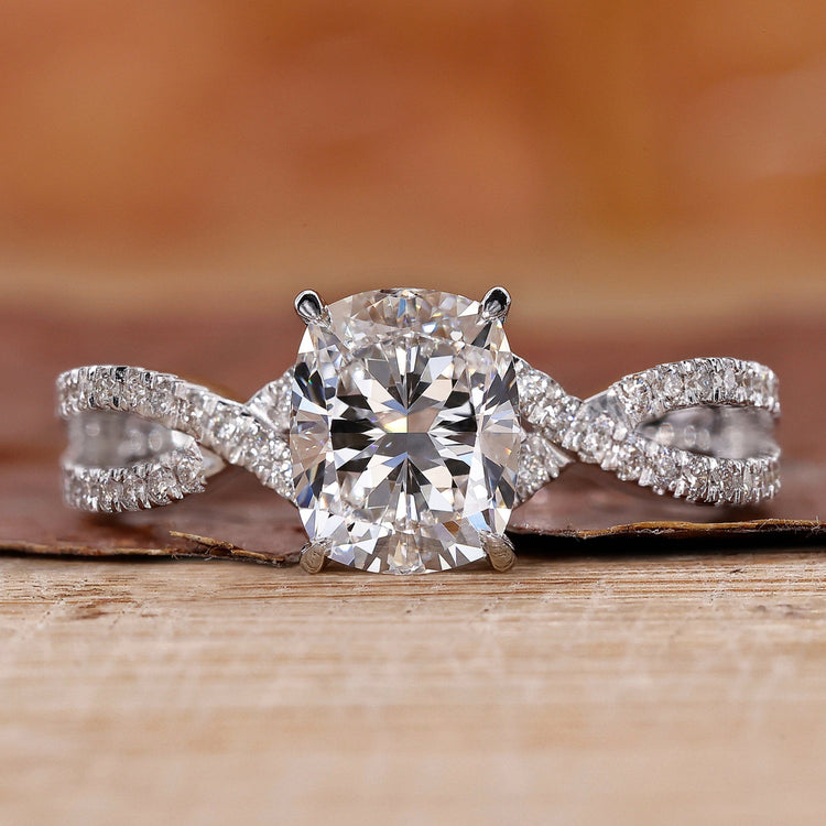 cushion cut engagement ring with twisted pave engagement ring.