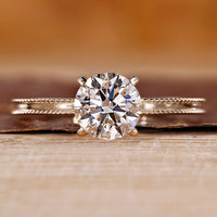 Yellow gold engagement ring with round cut diamond ring.