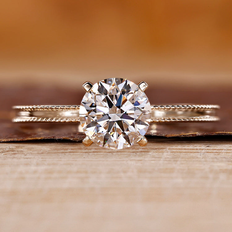 Yellow gold engagement ring with round cut diamond ring.