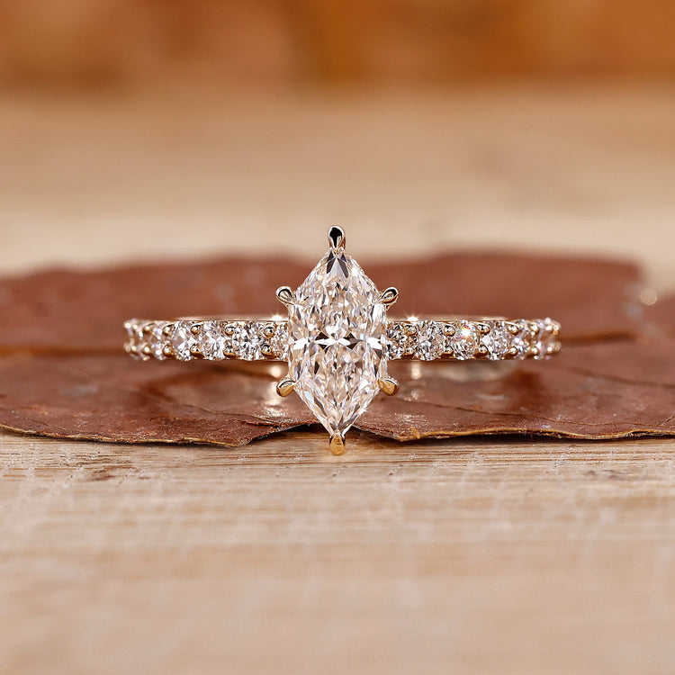 Hidden halo engagement ring with Dutch marquise ring.