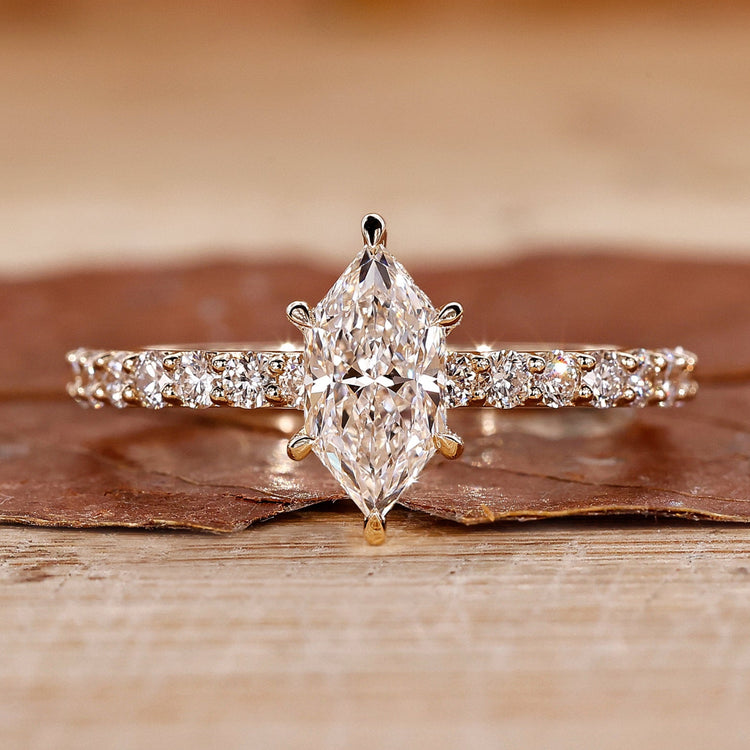 Hidden halo engagement ring with Dutch marquise ring.