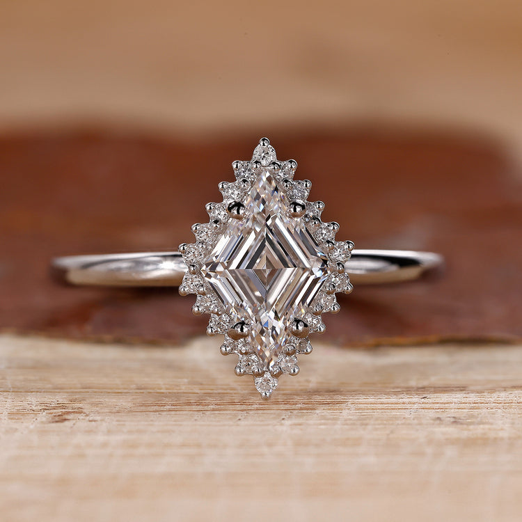 Halo diamond engagement ring with lozenge diamond engagement ring.