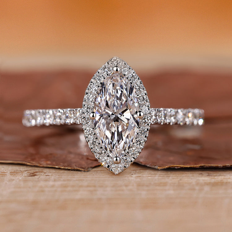 Halo diamond ring with round cut center stone.