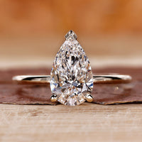 Pear diamond ring with v prong setting.