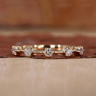 Yellow gold wedding band with round cut diamond band.