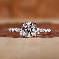 4 claw prong ring crafted in polished white gold.