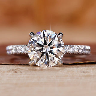 round cut engagement ring with pave ring setting.