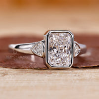 Trillion cut side stone fits radiant cut engagement ring.