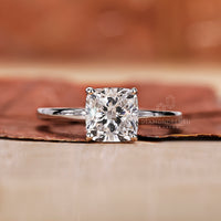 cushion cut diamond ring with 4 prong setting.