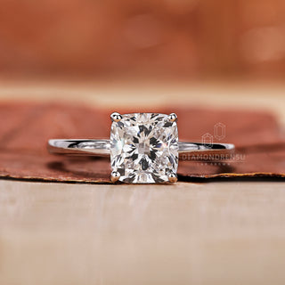 cushion cut diamond ring with 4 prong setting.