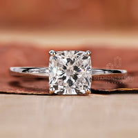 cushion cut diamond ring with 4 prong setting.