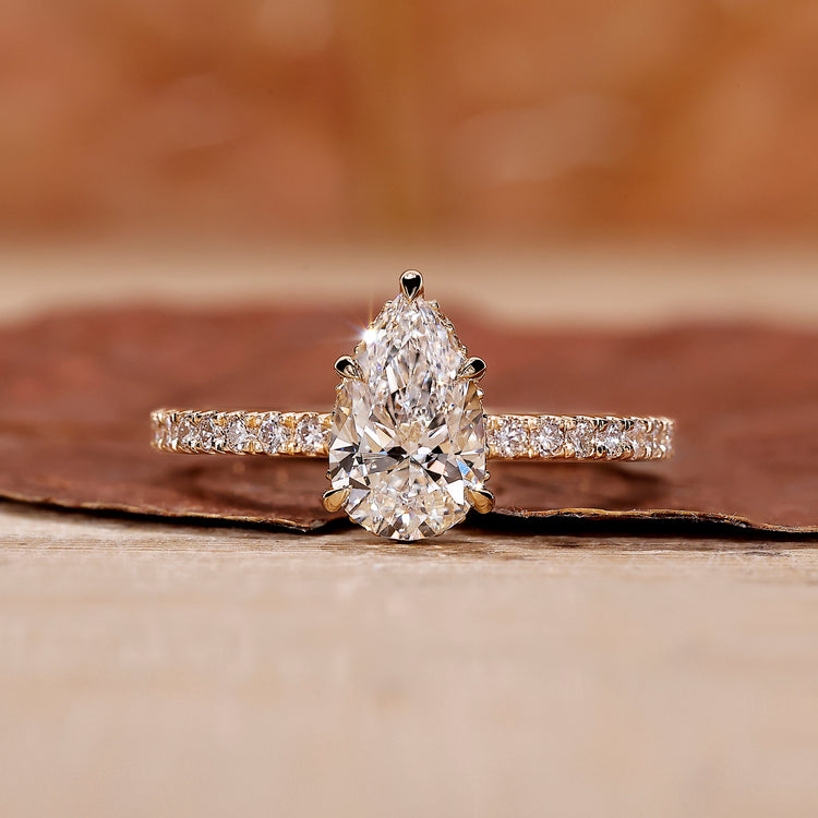 Pear diamond engagement ring with hidden halo setting