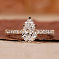 Pear diamond engagement ring with hidden halo setting