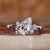 Elegant pear cut engagement ring with round side stones and basket setting, made of white gold. Elegant pear cut engagement ring with round side stones and basket setting, made of white gold.