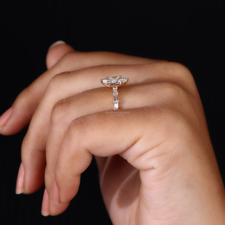 Customise ring with marquise diamond and pavé details.