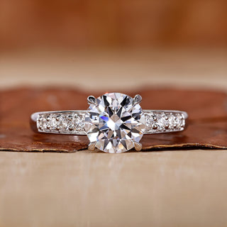 Hidden halo engagement ring with round cut diamond ring.