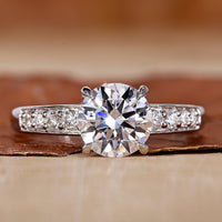 Hidden halo engagement ring with round cut diamond ring.