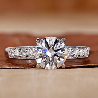 Hidden halo engagement ring with round cut diamond ring.