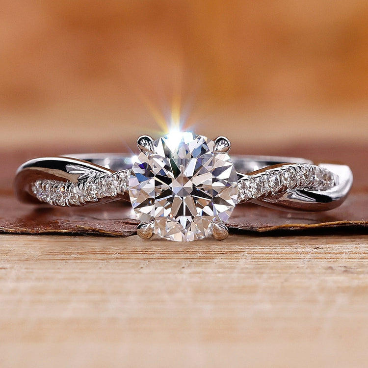 Close-Up of Round Diamond Engagement Ring with Twisted Pave Band