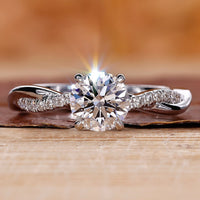 Close-Up of Round Diamond Engagement Ring with Twisted Pave Band