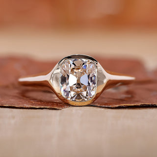Old mine cushion cut diamond ring with yellow gold engagement ring.