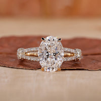 oval diamond engagement ring with split shank band.