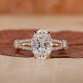 oval diamond engagement ring with split shank band.