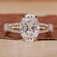 oval diamond engagement ring with split shank band.