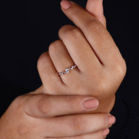 Prong setting secures the oval diamond for a refined look.