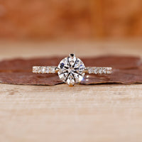 Yellow gold diamond ring with round cut diamond ring.