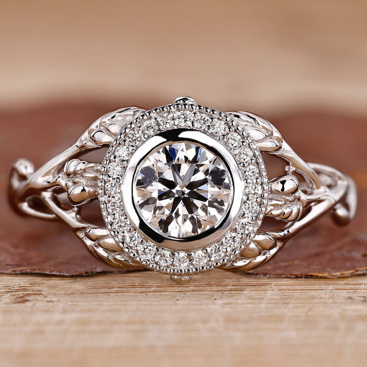 Bezel setting ring with round diamond and milgrain details.