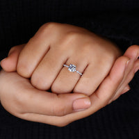 White gold engagement ring with classic round centre stone.