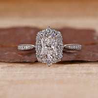 Radiant Engagement Ring with tapered shank and halo setting.