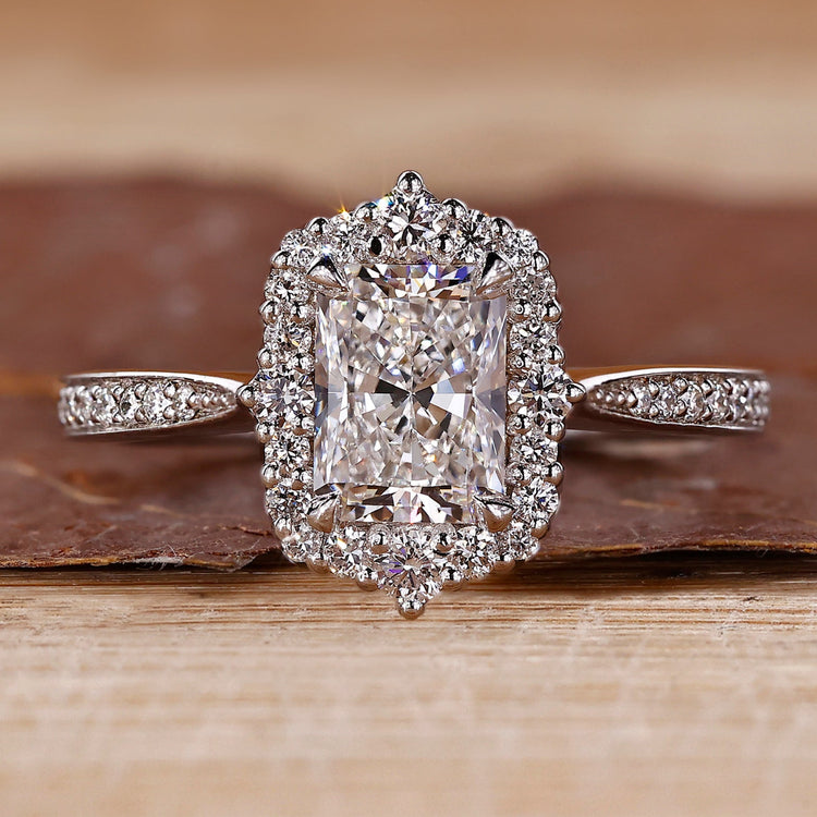 Radiant Engagement Ring with tapered shank and halo setting.