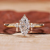 3 Stone Diamond Ring with marquise cut diamond ring.