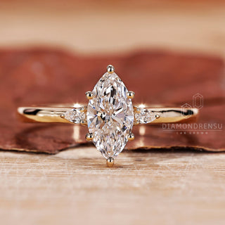 3 Stone Diamond Ring with marquise cut diamond ring.