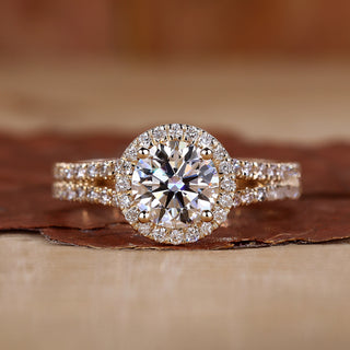 Halo diamond engagement ring in yellow gold with pavé detailing.