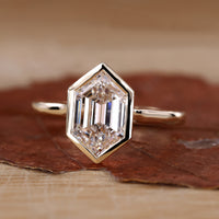 Hexagon engagement ring with yellow gold engagement ring.
