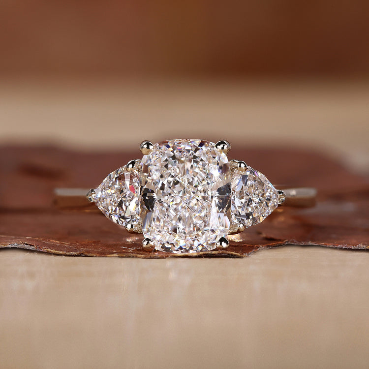 Cushion Cut Engagement Ring with trillion cut side stones ring.