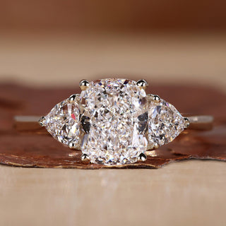 Cushion Cut Engagement Ring with trillion cut side stones ring.