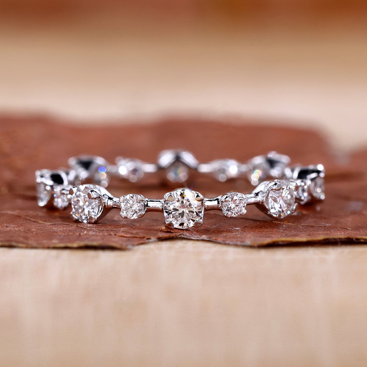 Round diamond wedding band with prong setting band.