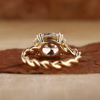 Twisted shank ring with lab grown diamond stones.