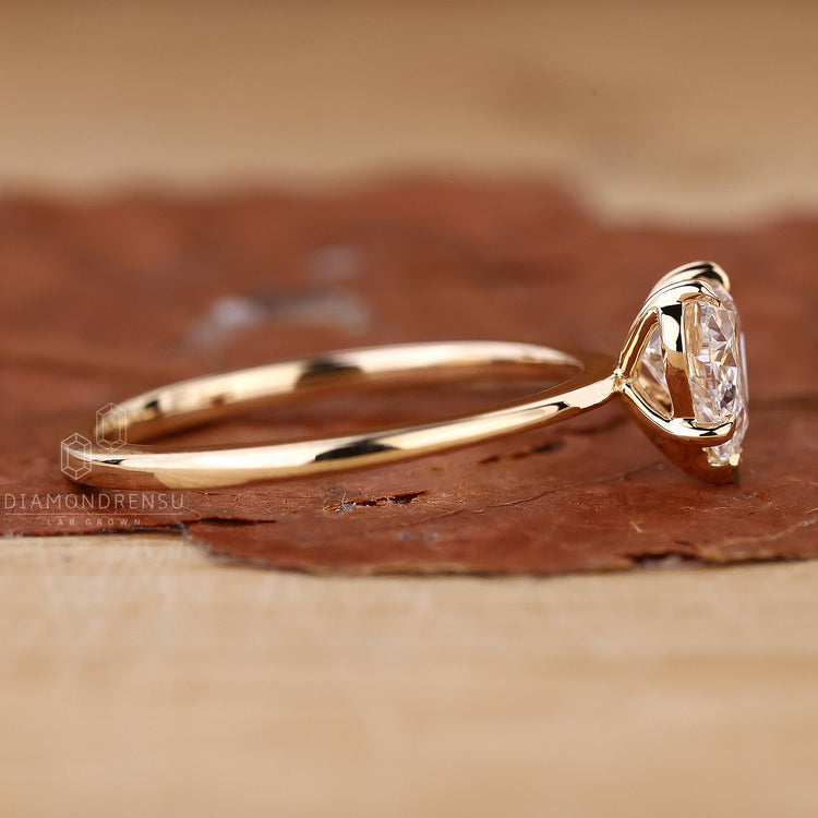 V prong engagement ring securing heart cut diamond.