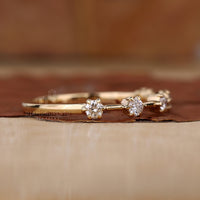 Buy wedding band with claw prong setting.
